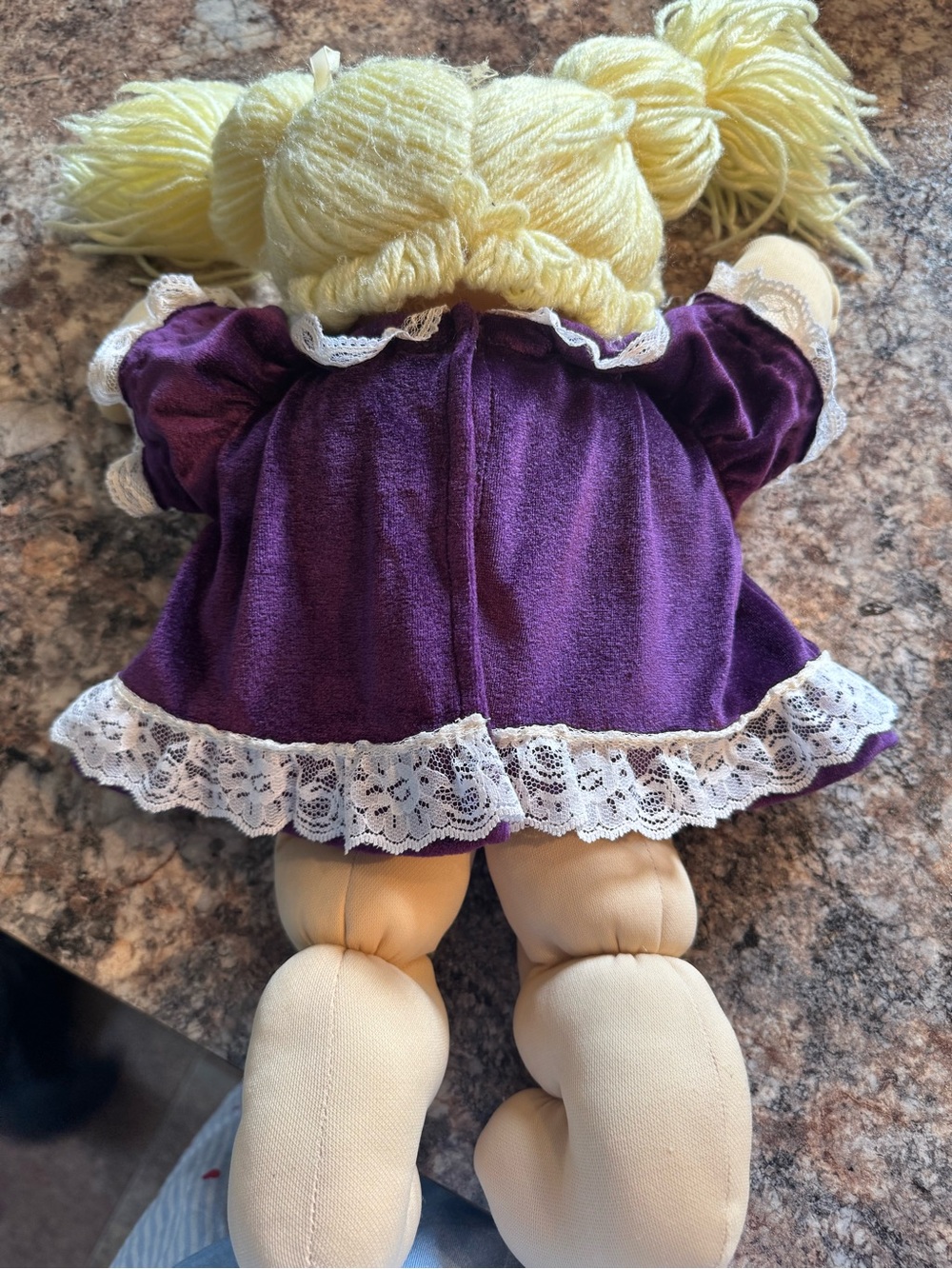 A Cabbage Patch Kid doll with blonde yarn hair and a purple dress - Picture 3 of 11